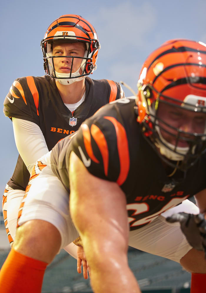 Joe Burrow takes a snap from Ted Karras